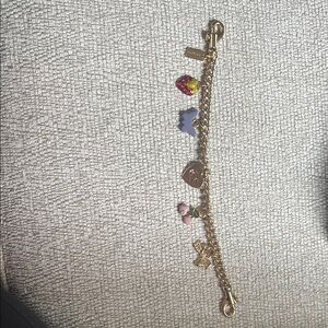 Charming Gold Coach Bag Charm with Colorful Charms